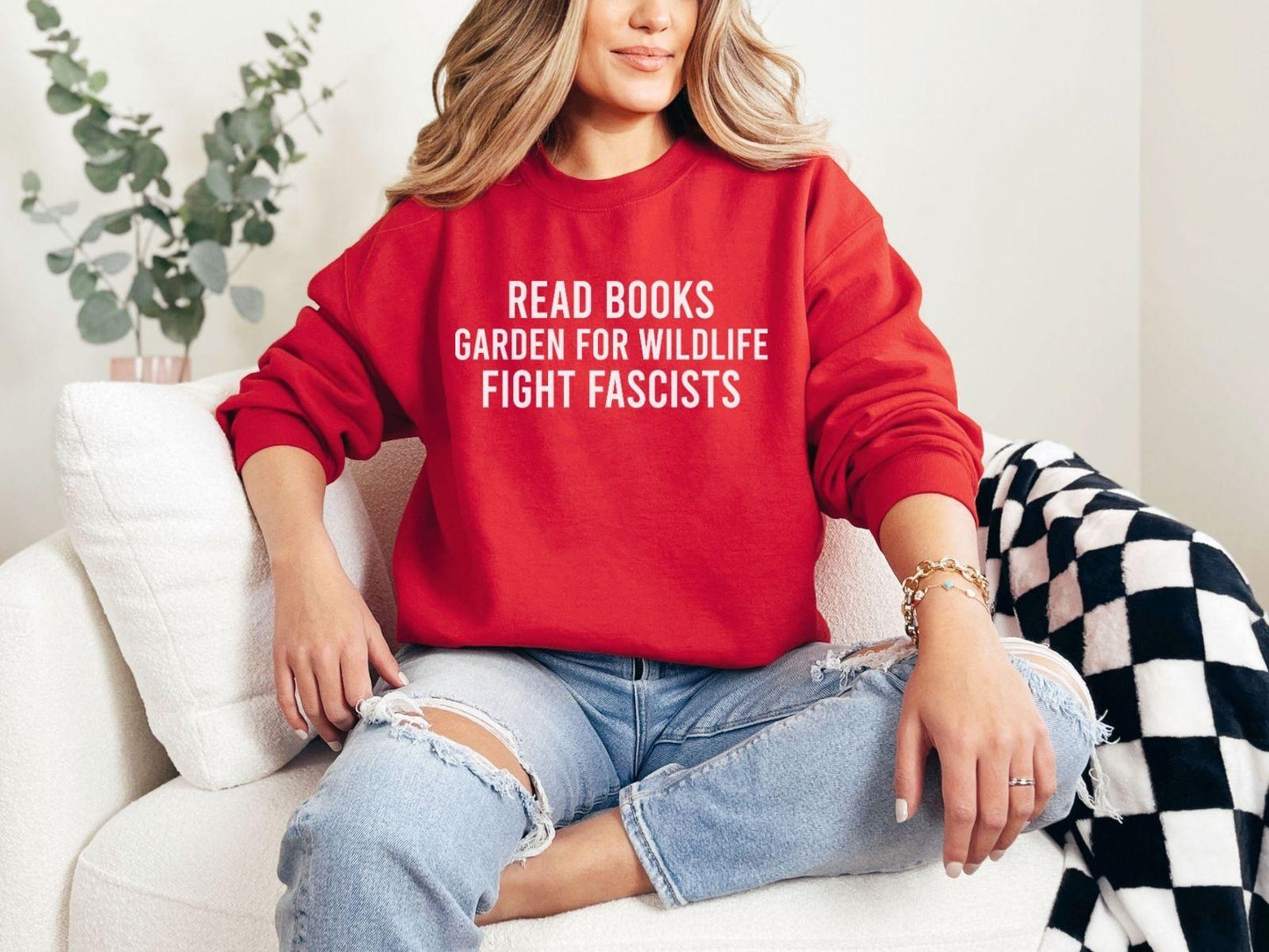 A Gildan 18000 sweatshirt with the saying "Read books garden for wildlife fight fascists"