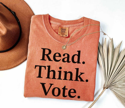A comfort colors® shirt with the saying "read think vote"