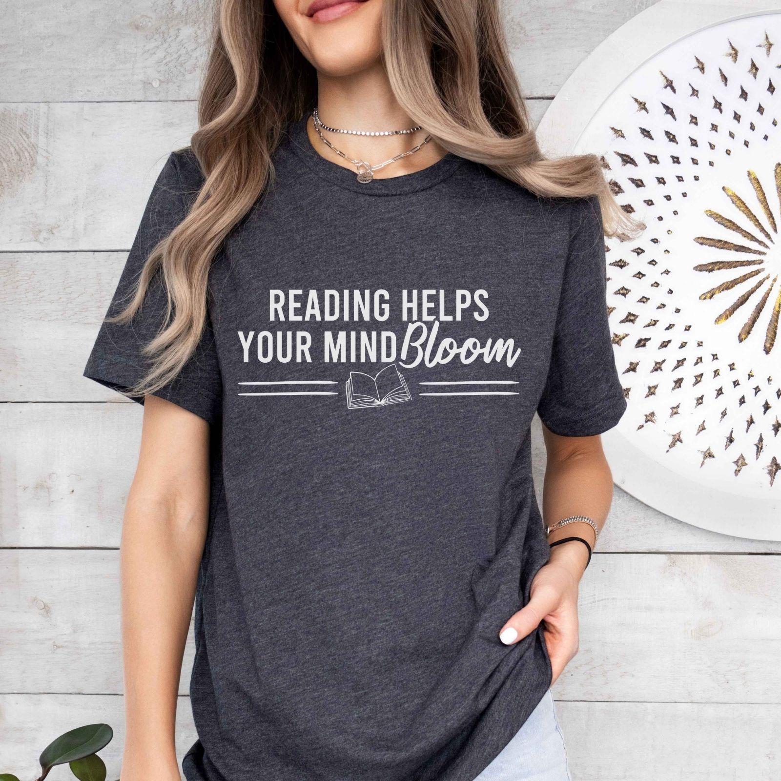 A comfort colors® shirt with the saying "reading helps your mind bloom"