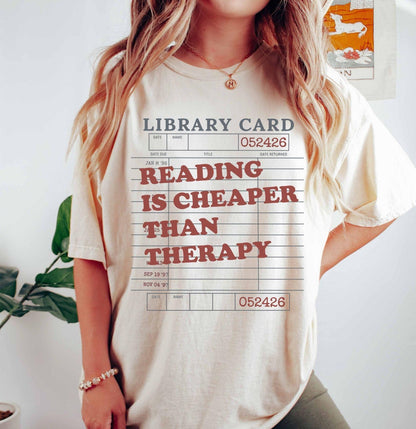 A comfort colors® shirt with the saying "reading is cheaper than therapy"