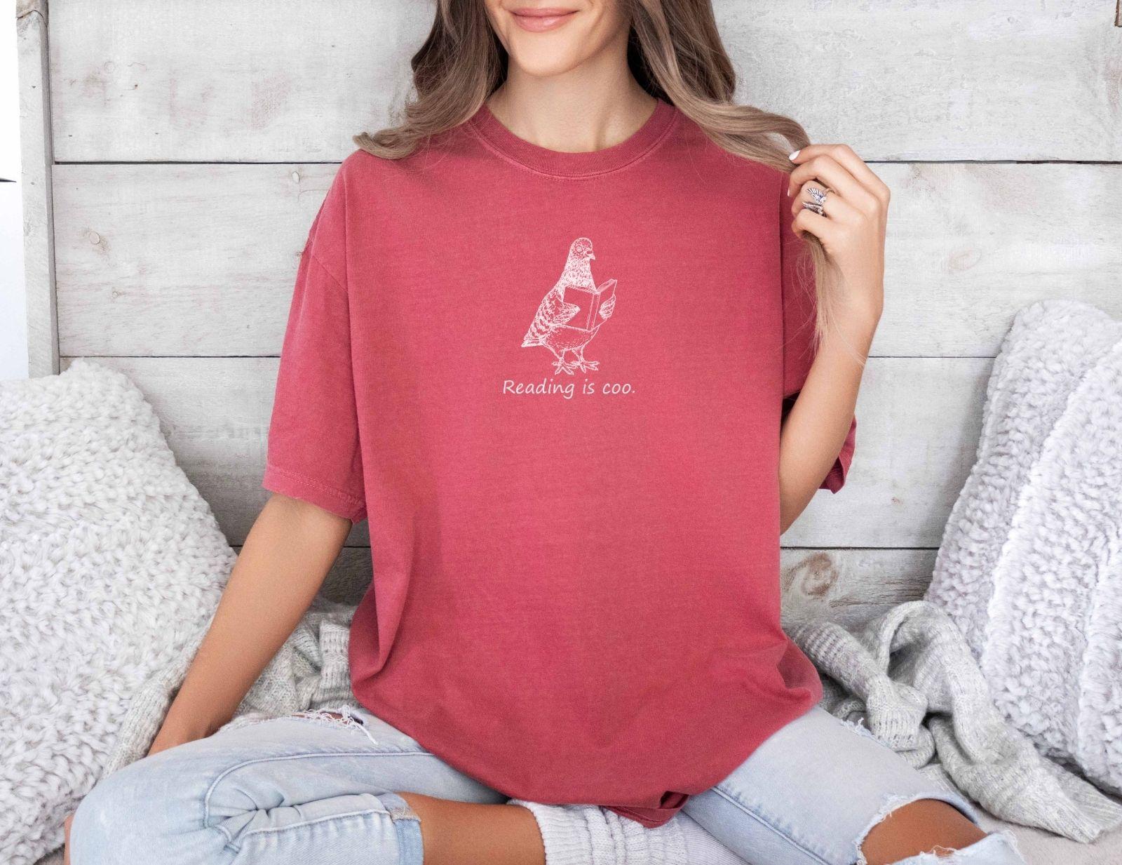 A comfort colors® shirt with the saying "reading is coo"