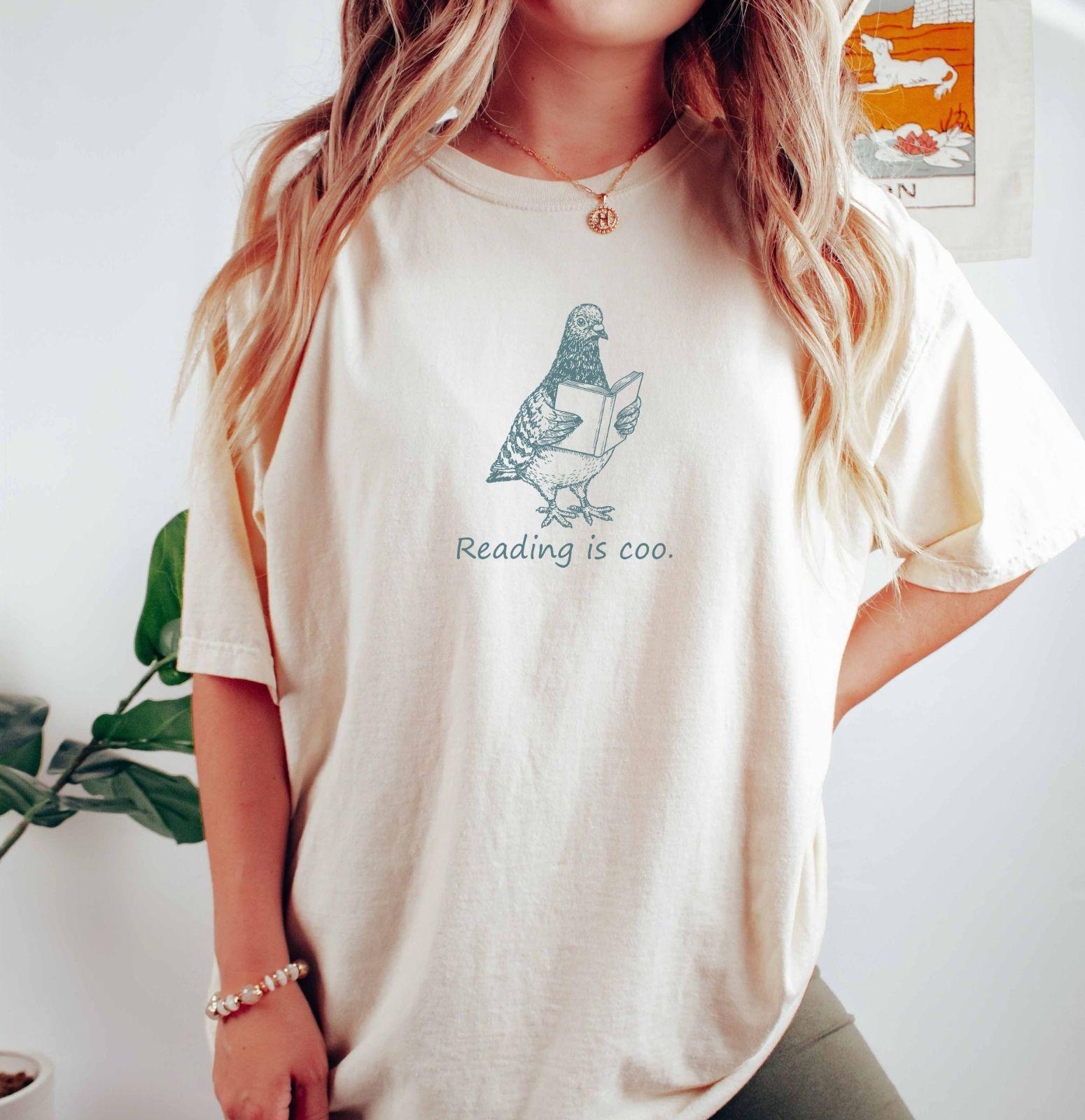A comfort colors® shirt with the saying "reading is coo"
