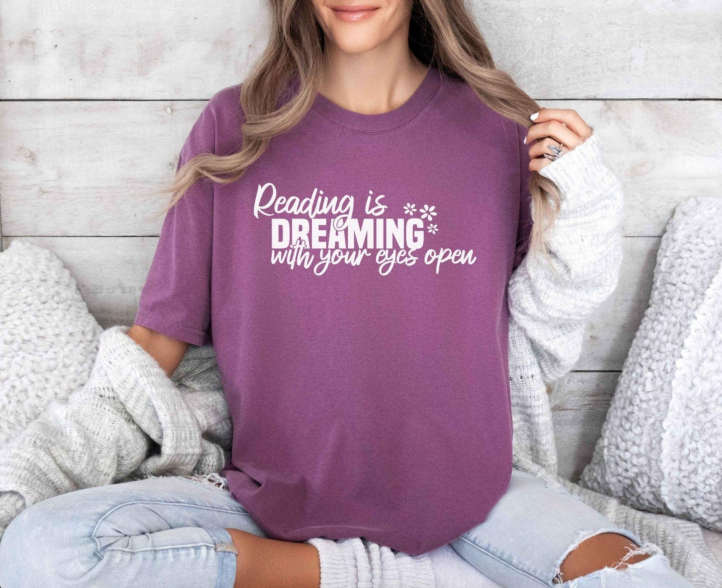 A comfort colors® shirt with the saying "Reading is dreaming with your eyes open"