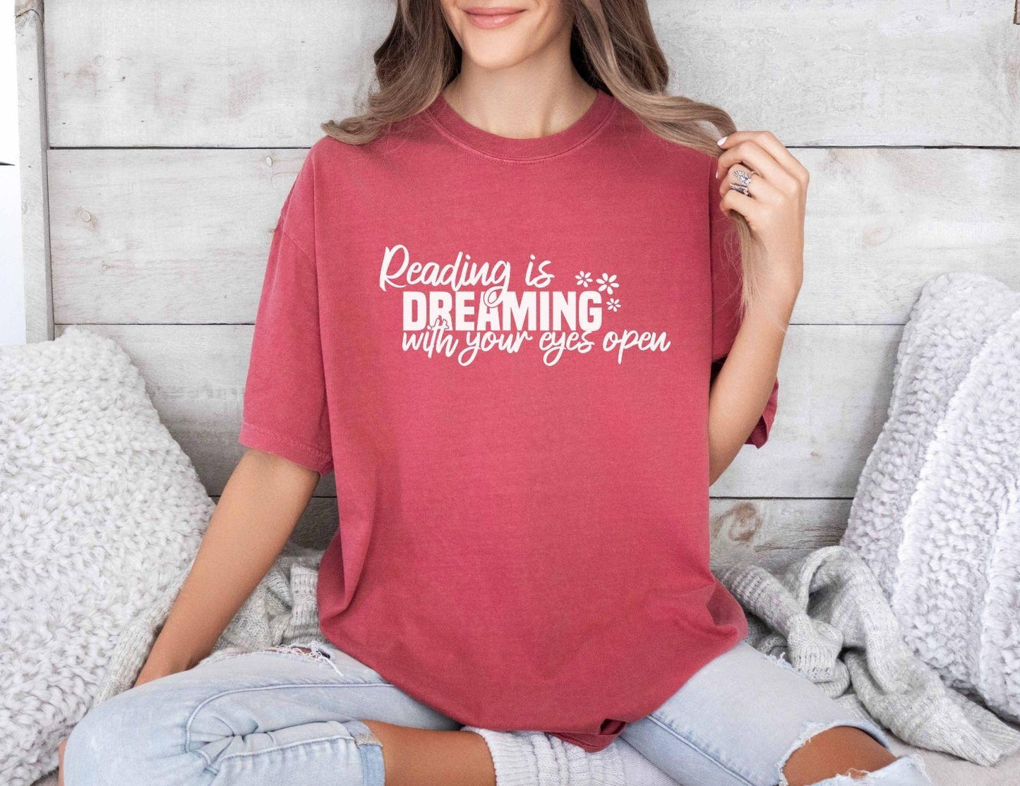 A comfort colors® shirt with the saying "Reading is dreaming with your eyes open"