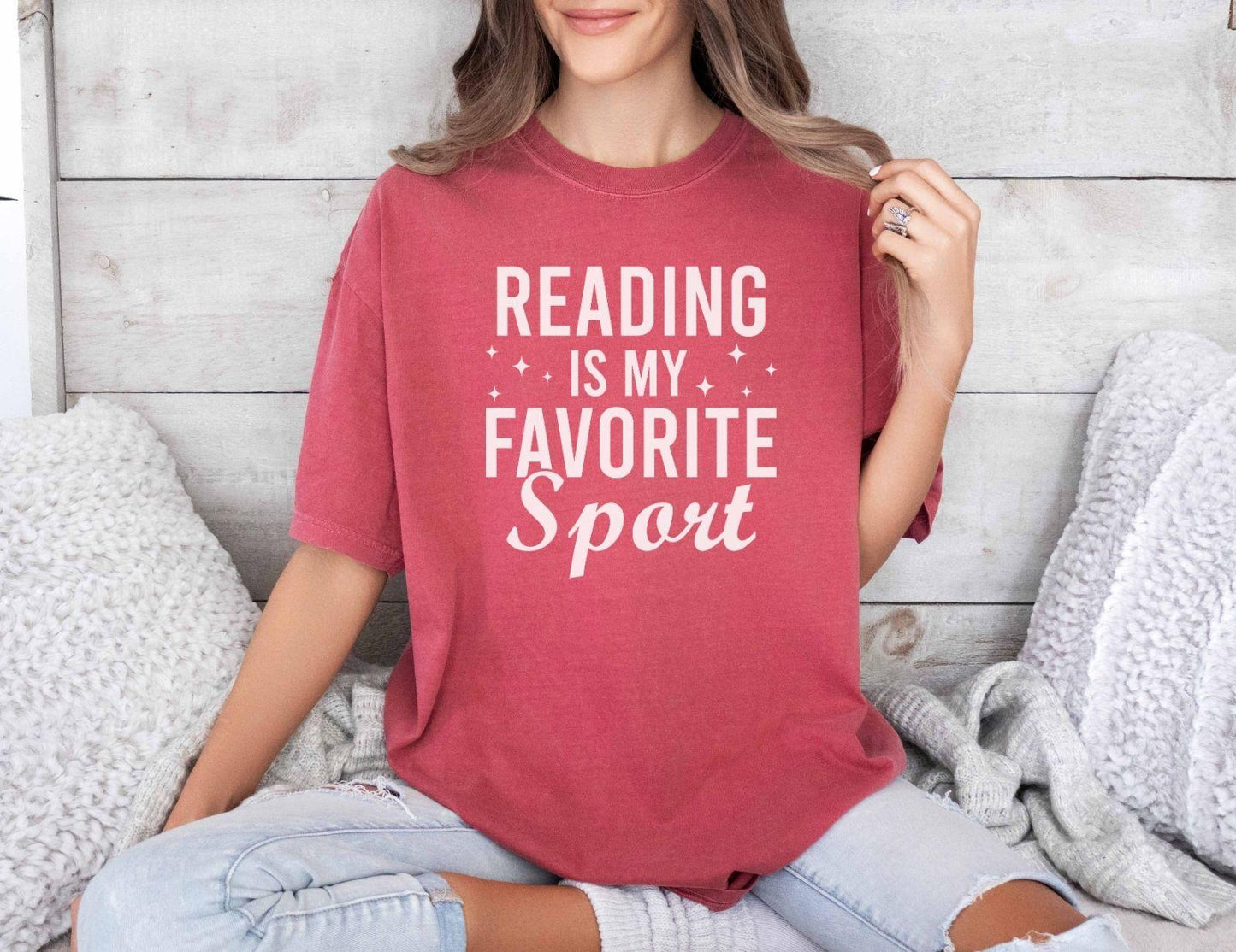 A comfort colors® shirt with the saying "Reading is my favorite sport"