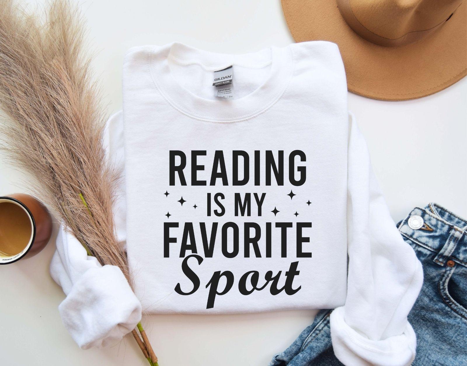 A Gildan 18000 sweatshirt with the saying "Reading is my favorite sport"