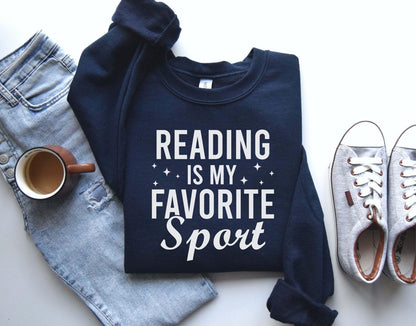 A Gildan 18000 sweatshirt with the saying "Reading is my favorite sport"