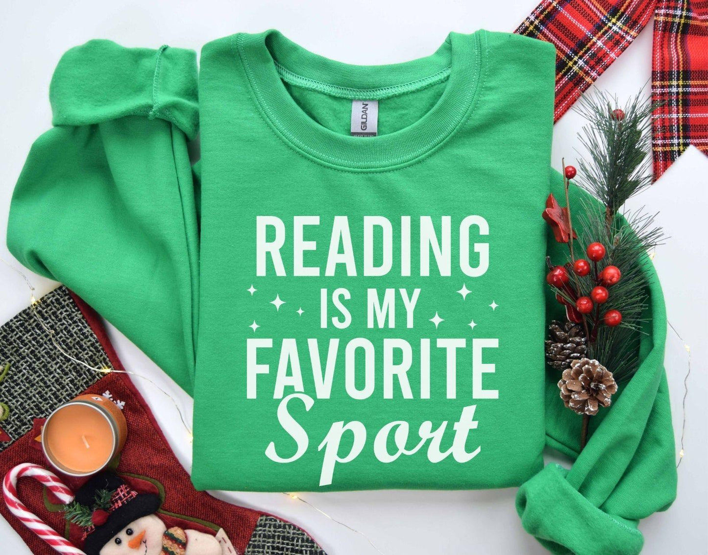 A Gildan 18000 sweatshirt with the saying "Reading is my favorite sport"