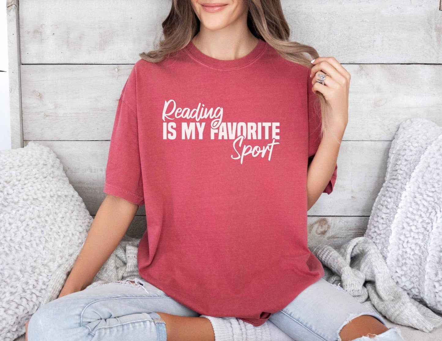 A comfort colors® shirt with the saying "Reading is my favorite sport"
