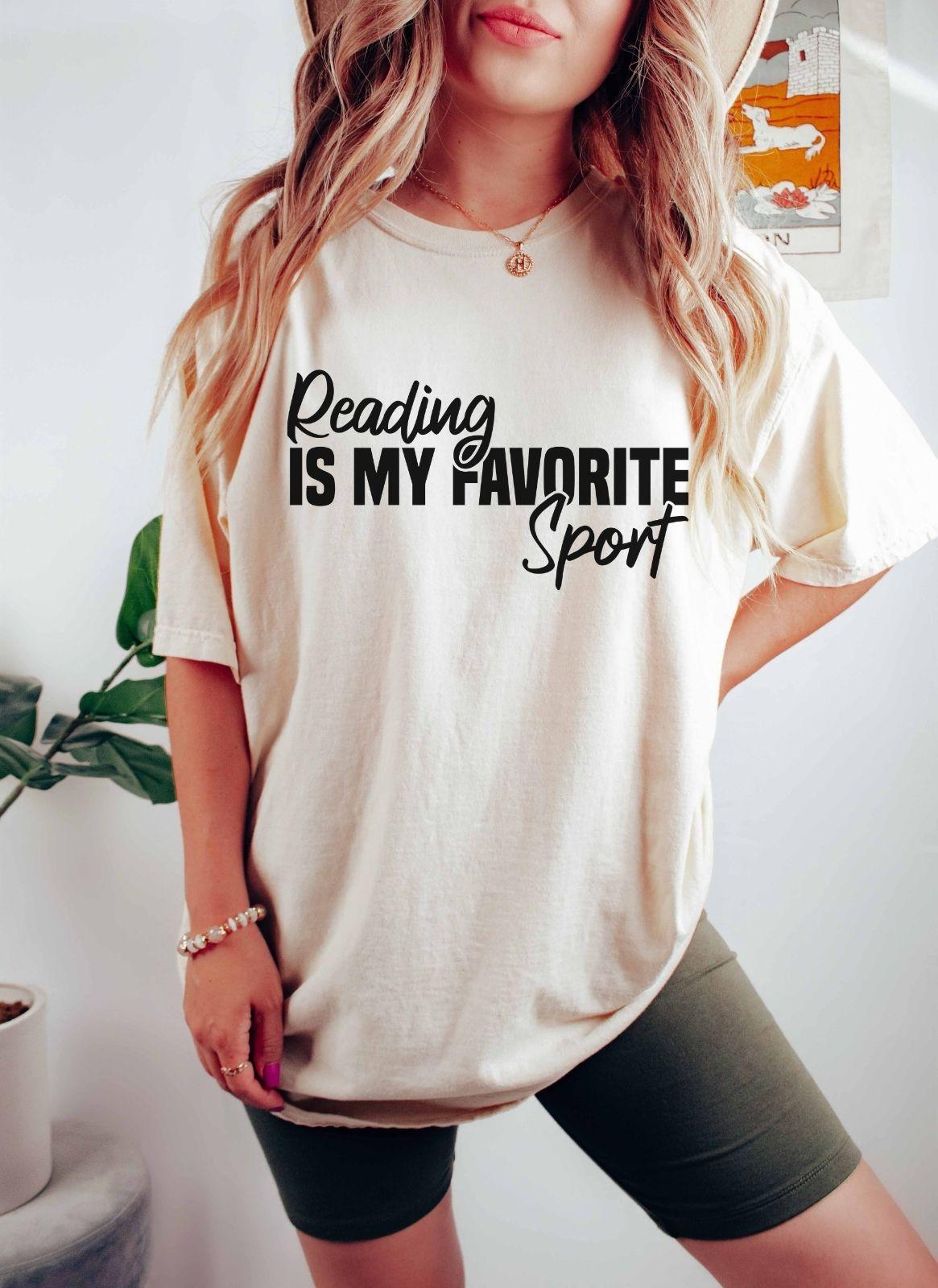 A comfort colors® shirt with the saying "Reading is my favorite sport"