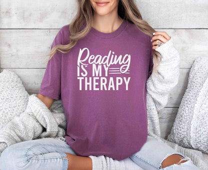 A comfort colors® shirt with the saying "Reading is my therapy"