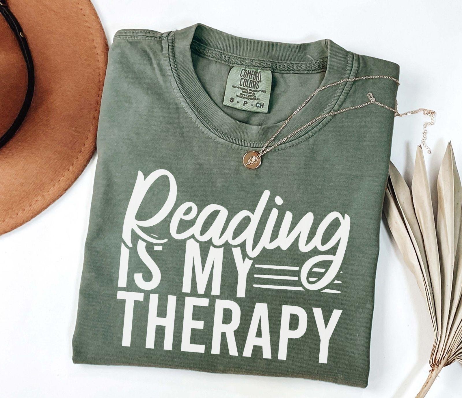 A comfort colors® shirt with the saying "Reading is my therapy"