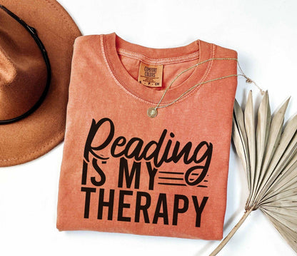 A comfort colors® shirt with the saying "Reading is my therapy"