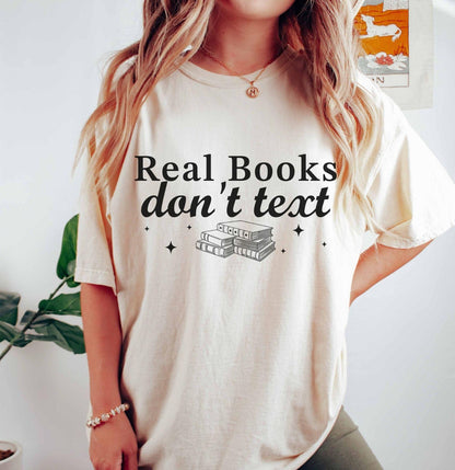 A comfort colors® shirt with the saying "Real books don't text"