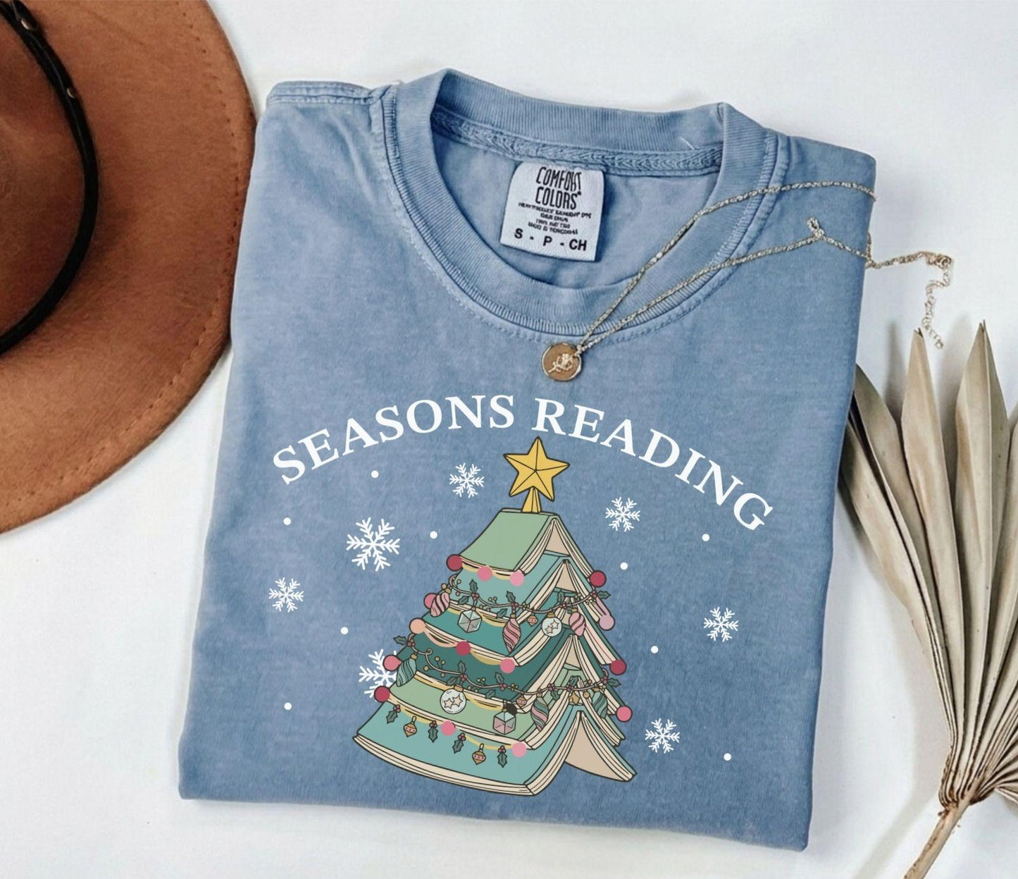 A comfort colors® shirt with the saying "Seasons reading"