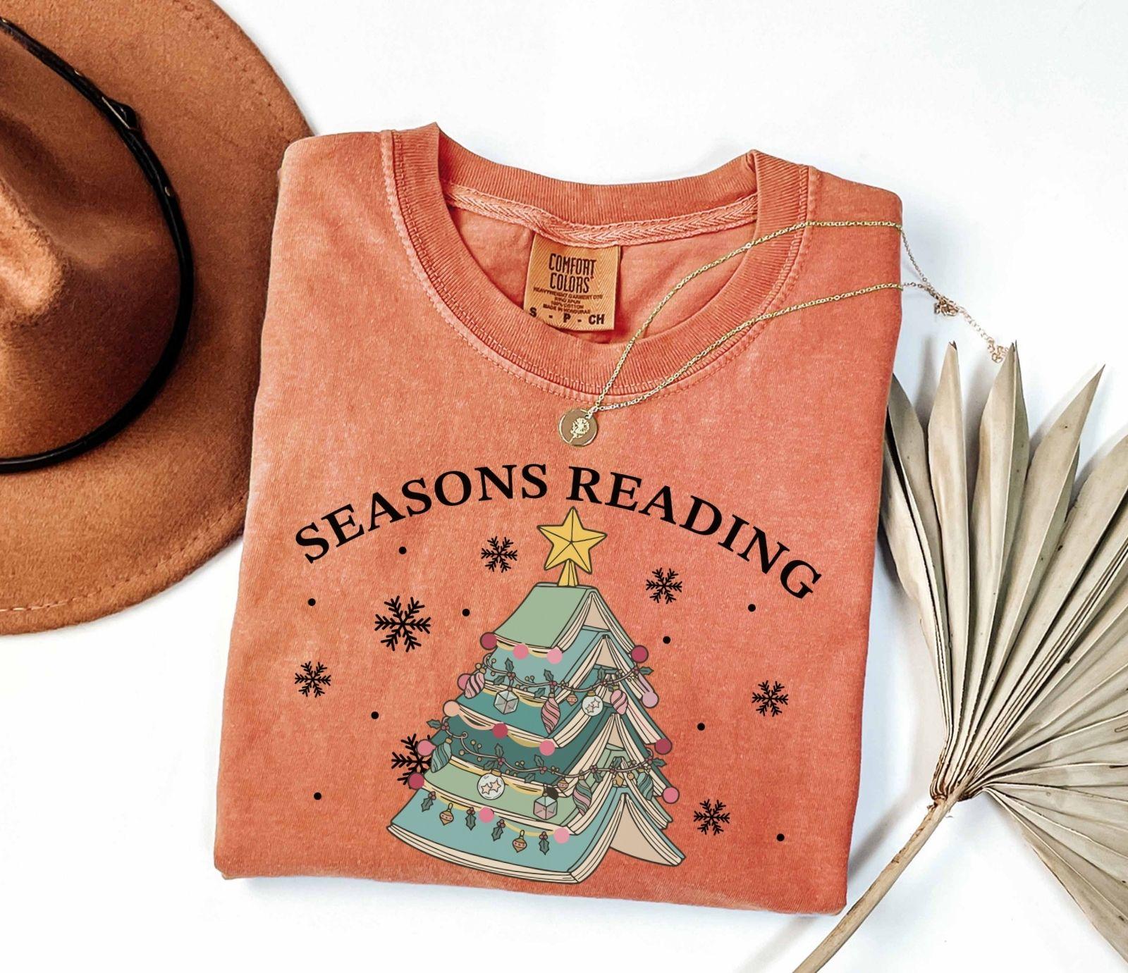 A comfort colors® shirt with the saying "Seasons reading"