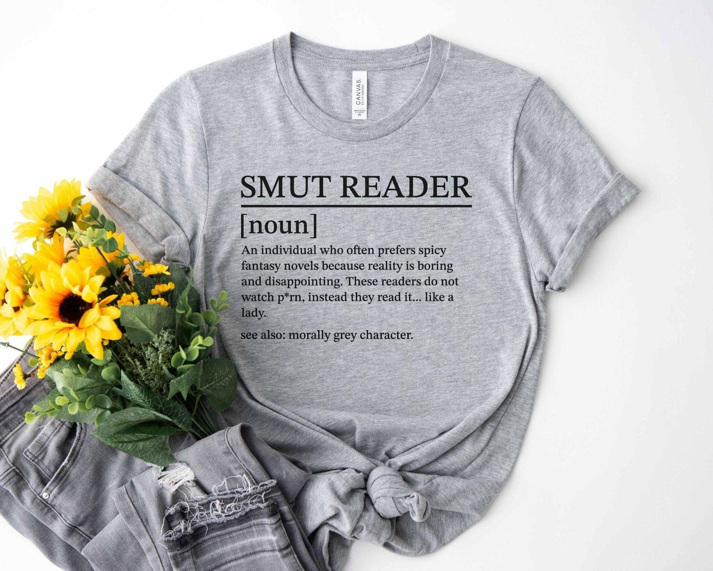 A bella canvas 3001 shirt with the saying "smut reader definition"