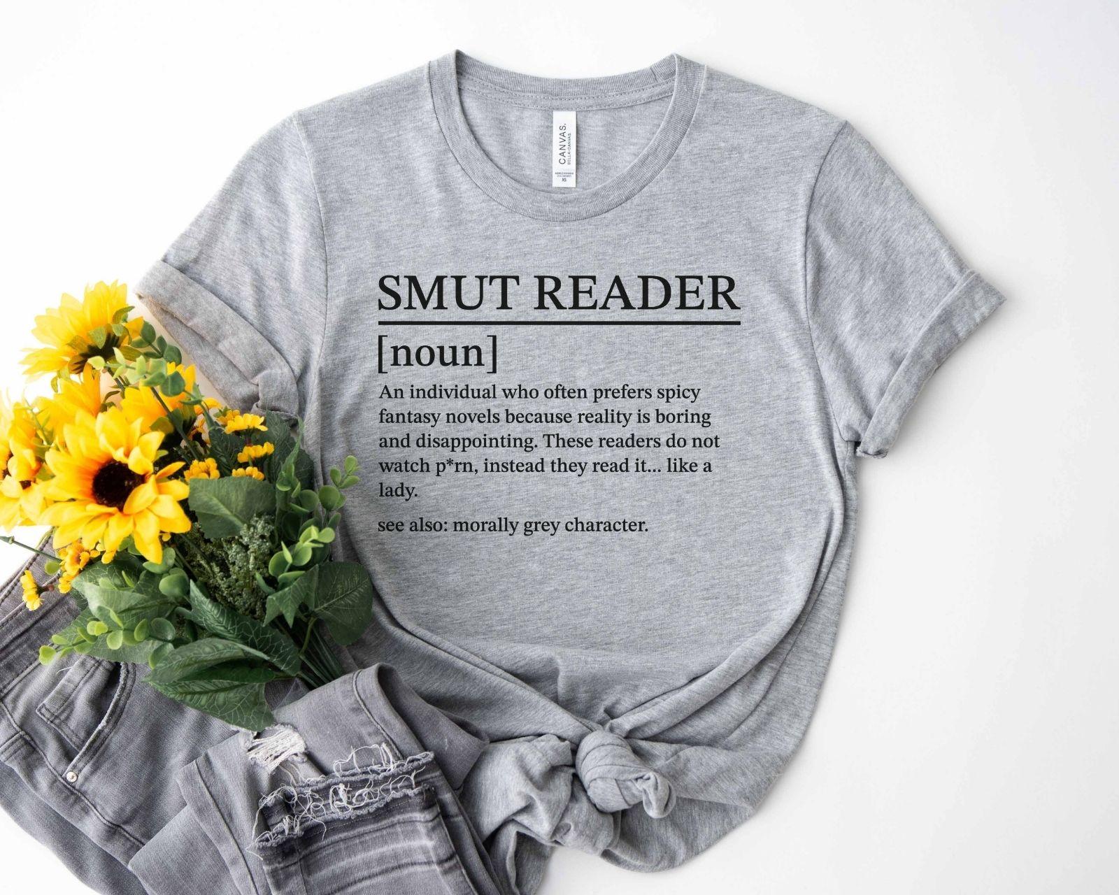 A bella canvas 3001 shirt with the saying "smut reader definition"