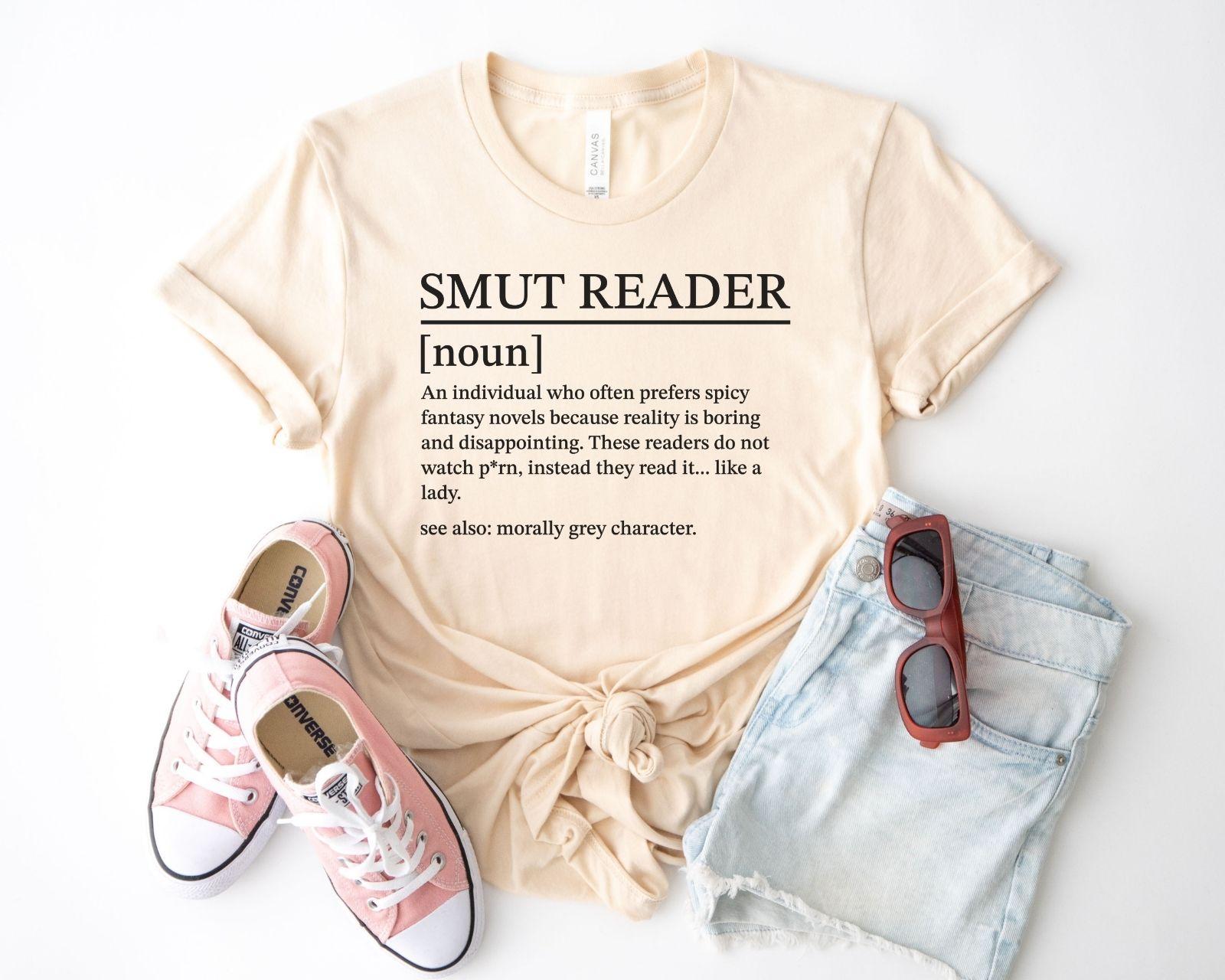 A bella canvas 3001 shirt with the saying "smut reader definition"