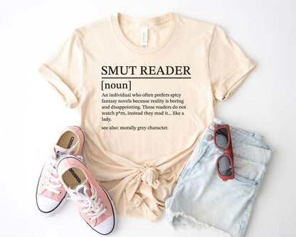 A bella canvas 3001 shirt with the saying "smut reader definition"