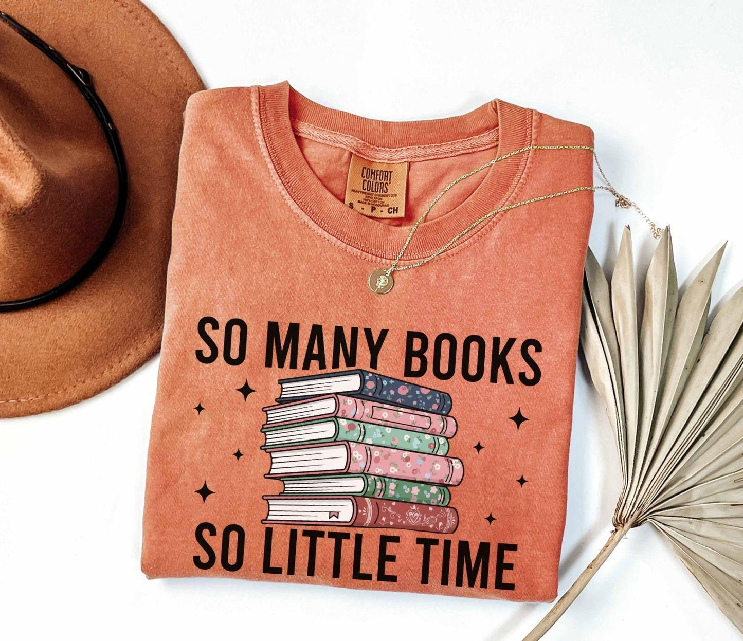 A comfort colors® shirt with the saying "so many books so little time"