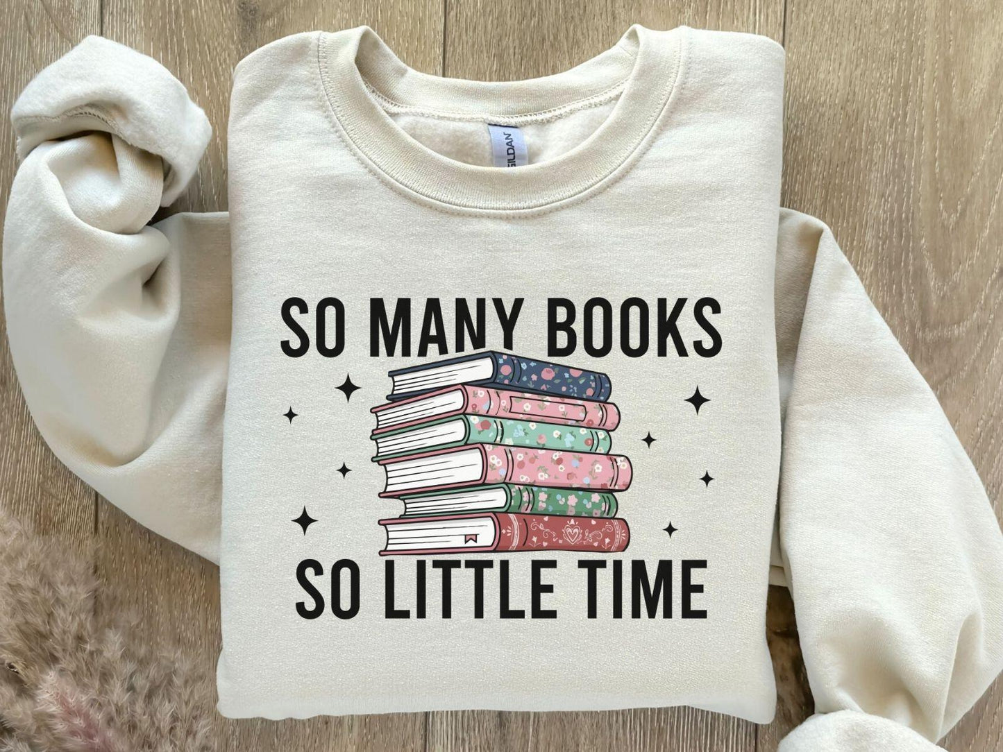 A Gildan 18000 sweatshirt with the saying "so many books so little time"
