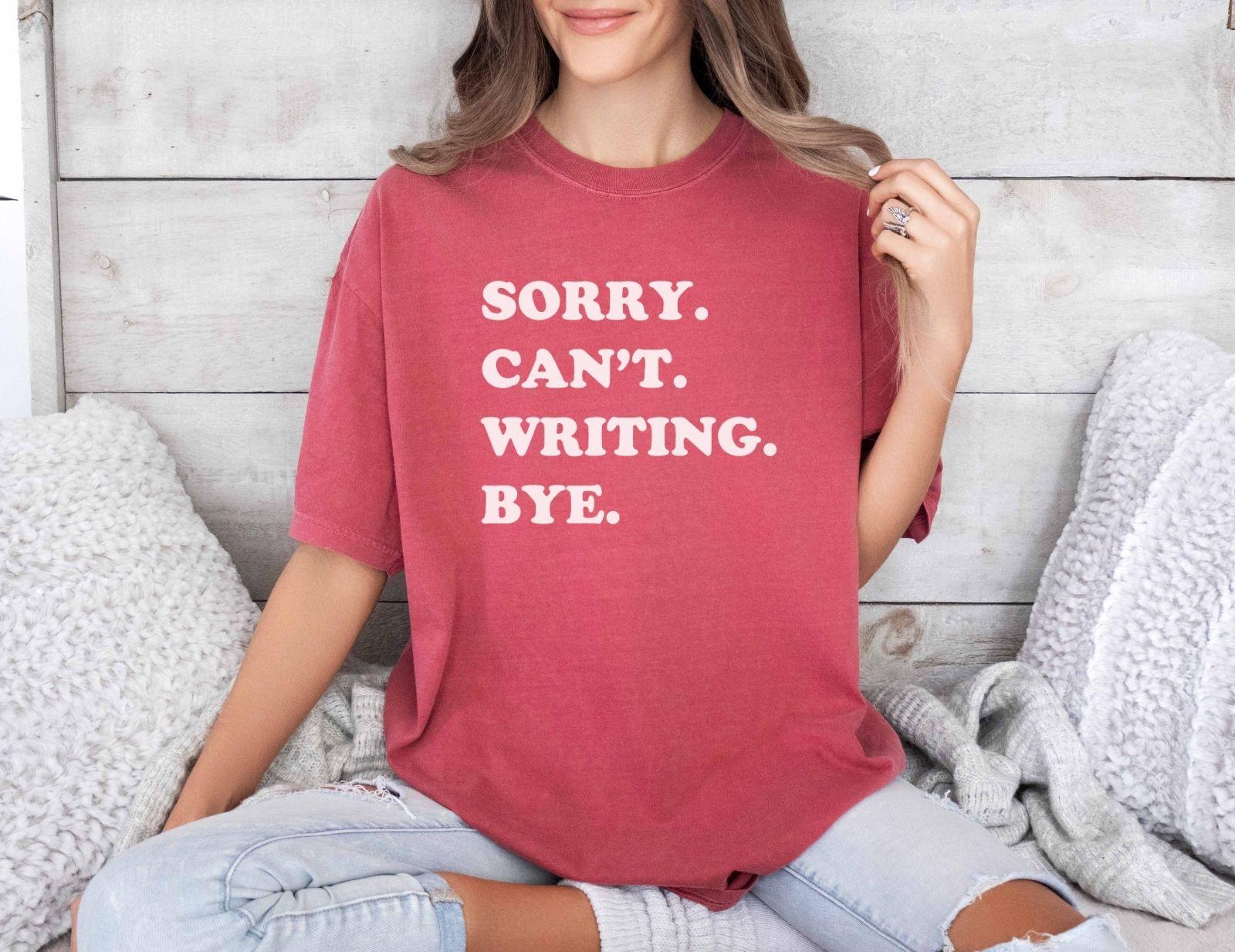 A comfort colors® shirt with the saying "sorry can't writing bye"