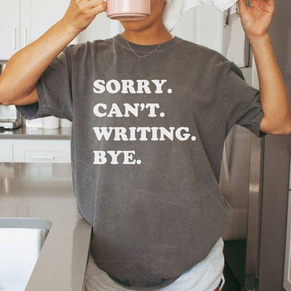 A comfort colors® shirt with the saying "sorry can't writing bye"