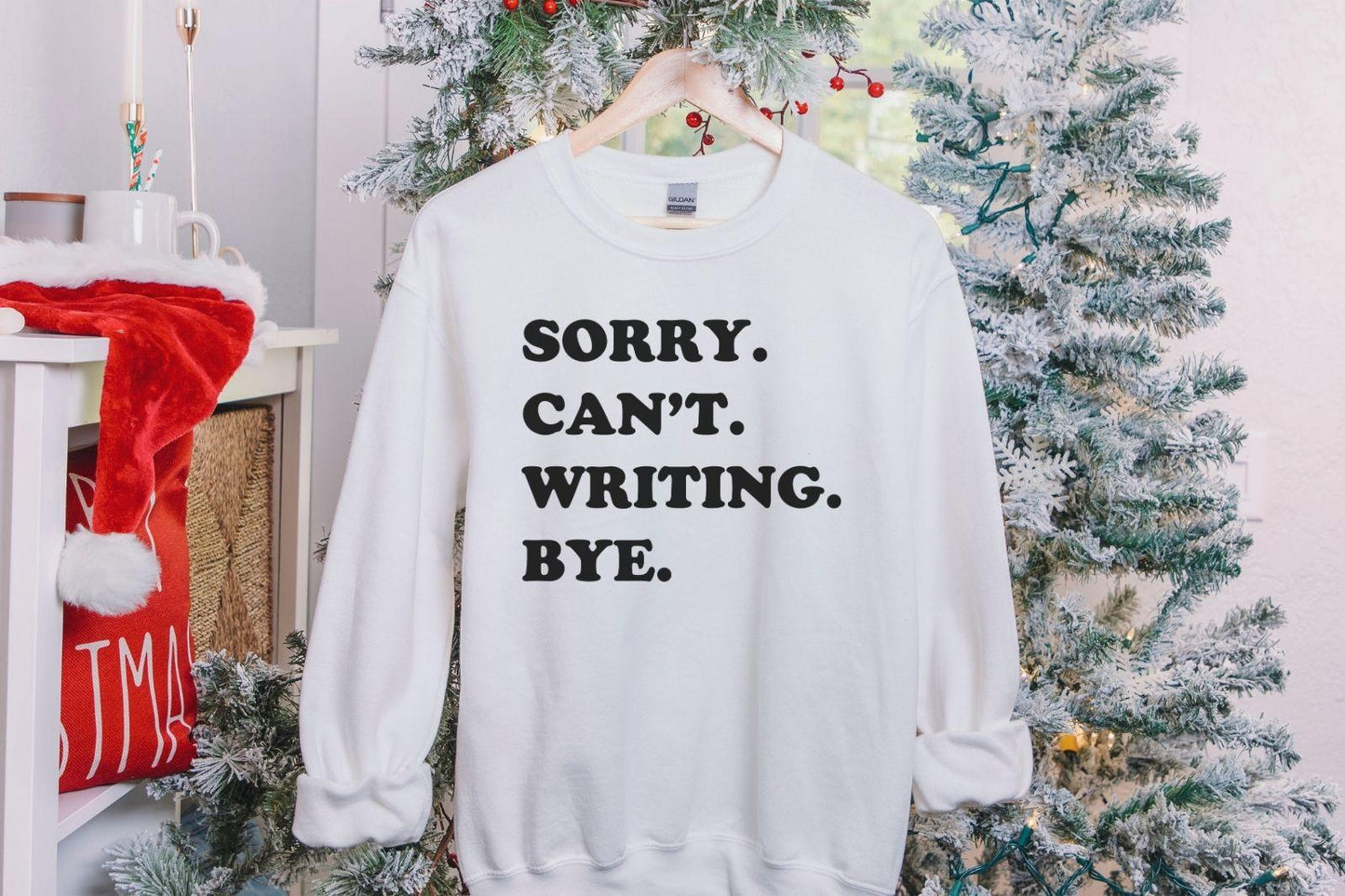 A Gildan 18000 sweatshirt with the saying "sorry can't writing bye"