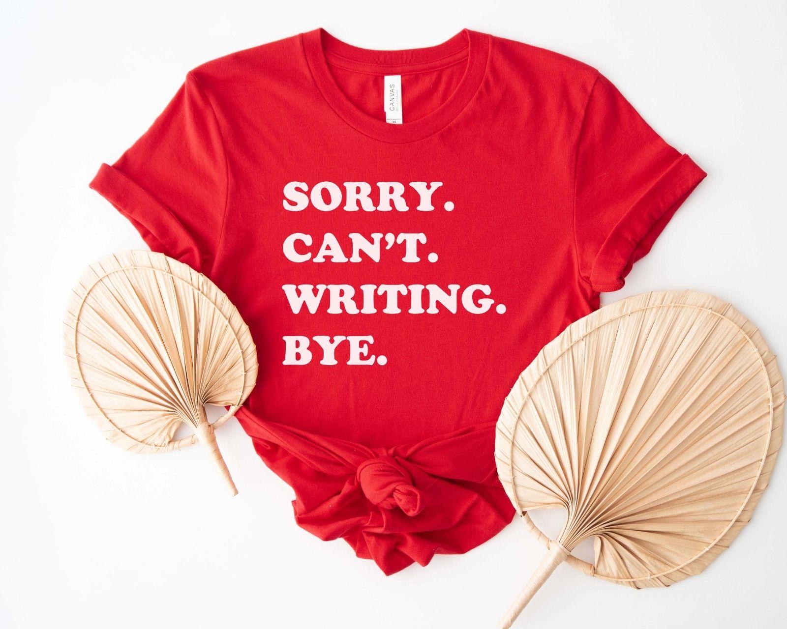 A comfort colors® shirt with the saying "sorry can't writing bye"