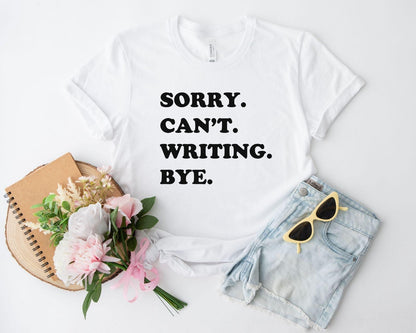 A comfort colors® shirt with the saying "sorry can't writing bye"