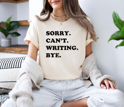 A comfort colors® shirt with the saying "sorry can't writing bye"