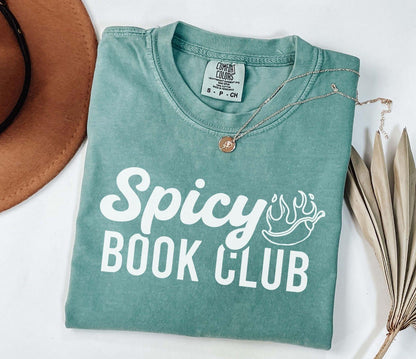 A comfort colors shirt with the saying "Spicy book club"