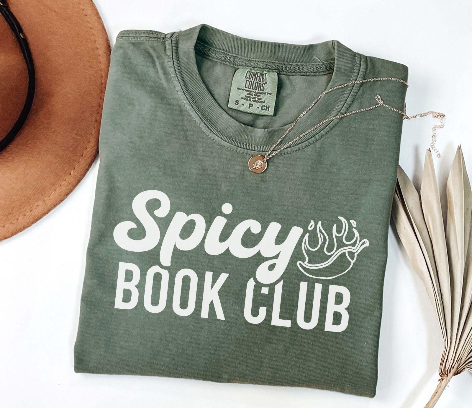 A comfort colors shirt with the saying "Spicy book club"