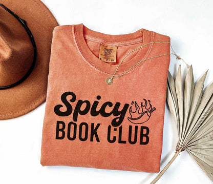 A comfort colors shirt with the saying "Spicy book club"
