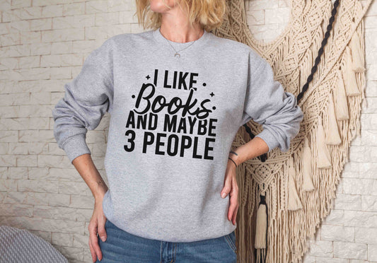 A Sport Grey color sweatshirt with the saying "I like books and maybe 3 people"