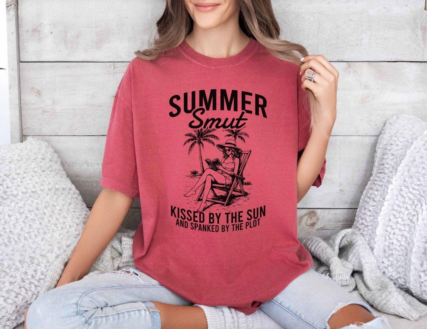 A comfort colors shirt with the saying "Summer smut kissed by the sun"
