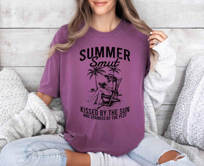 A comfort colors shirt with the saying "Summer smut kissed by the sun"