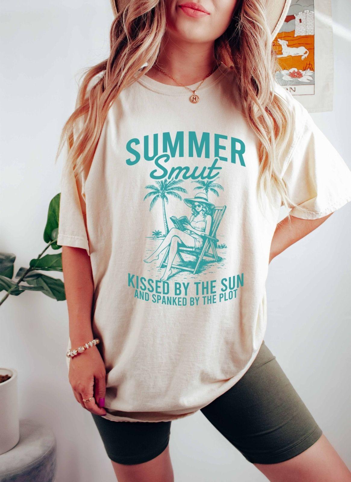 A comfort colors shirt with the saying "Summer smut kissed by the sun"