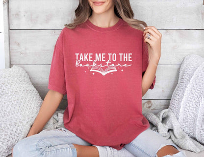 A comfort colors shirt with the saying "Take me to the bookstore"