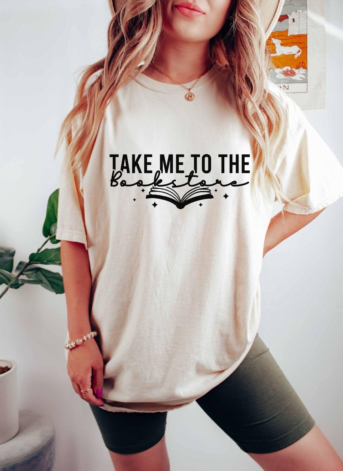 A comfort colors shirt with the saying "Take me to the bookstore"