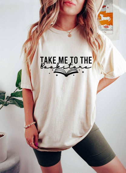 A comfort colors shirt with the saying "Take me to the bookstore"