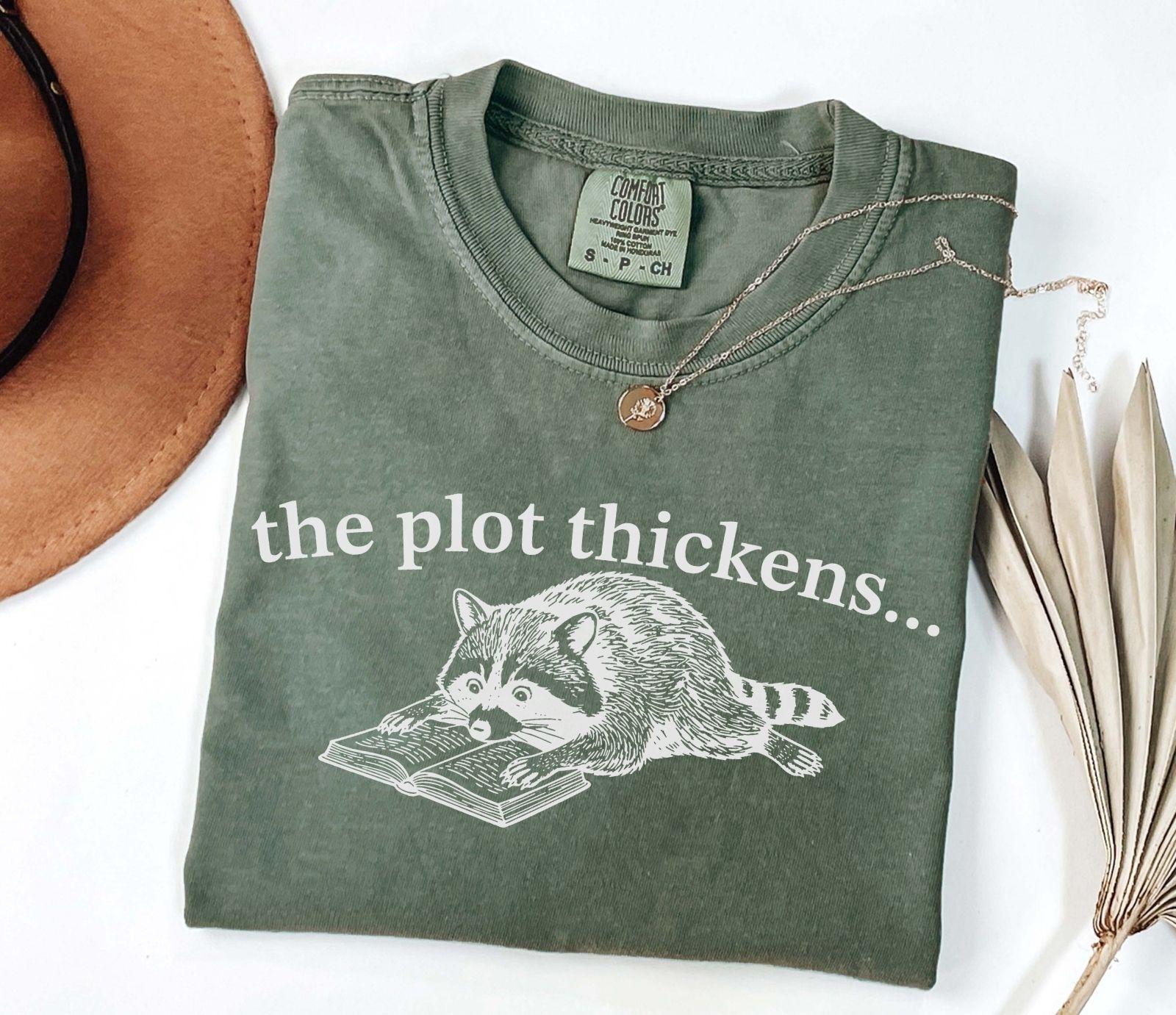 A comfort colors® shirt with the saying "the plot thickens"