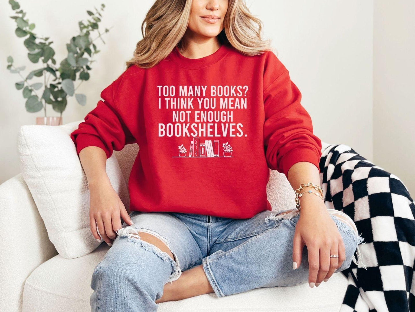 A Gildan 18000 sweatshirt with the saying "too many books I think you mean not enough bookshelves"