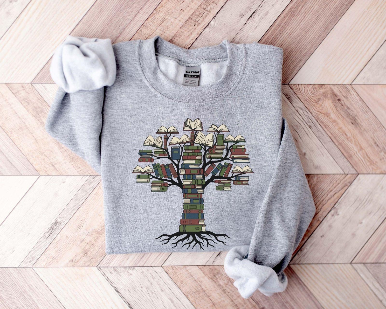 A Gildan 18000 sweatshirt with the saying "books tree graphic"