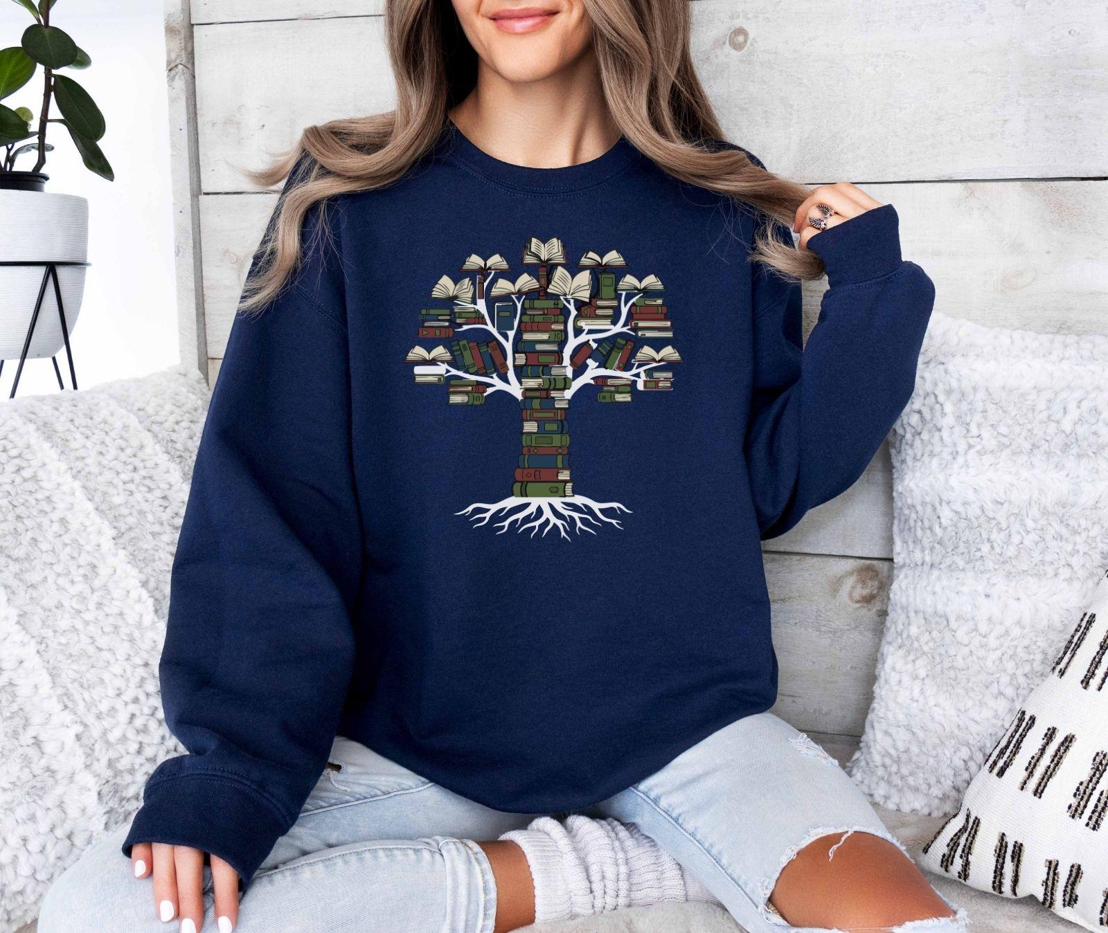 A Gildan 18000 sweatshirt with the saying "books tree graphic"