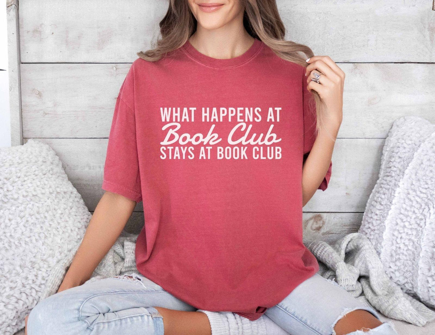 A comfort colors® shirt with the saying "what happens at book club stays at book club"