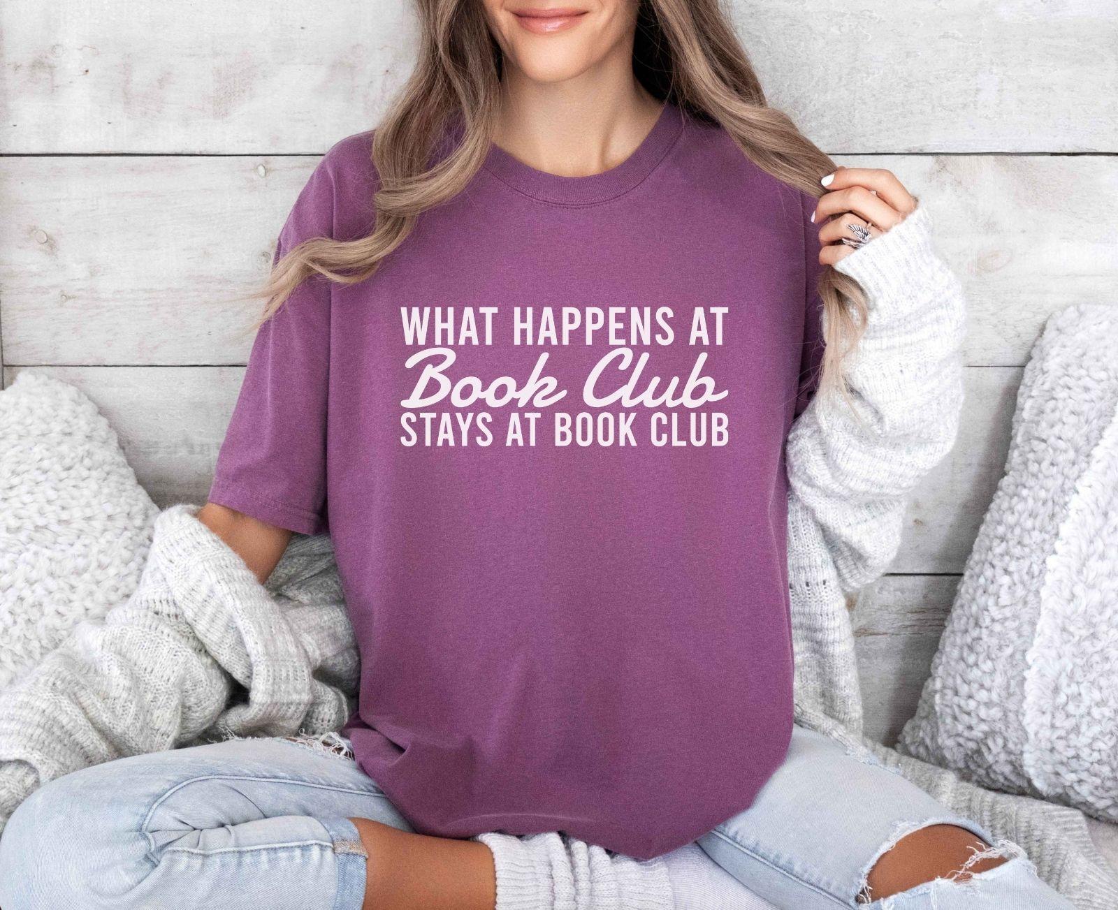A comfort colors® shirt with the saying "what happens at book club stays at book club"