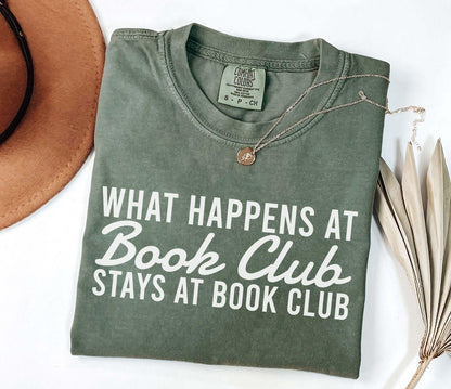 A comfort colors® shirt with the saying "what happens at book club stays at book club"