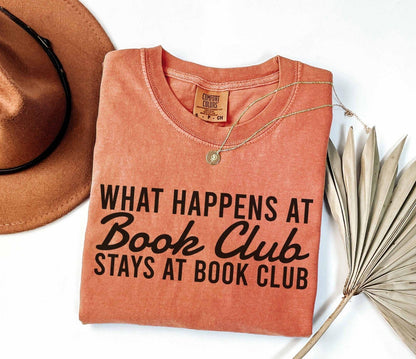 A comfort colors® shirt with the saying "what happens at book club stays at book club"